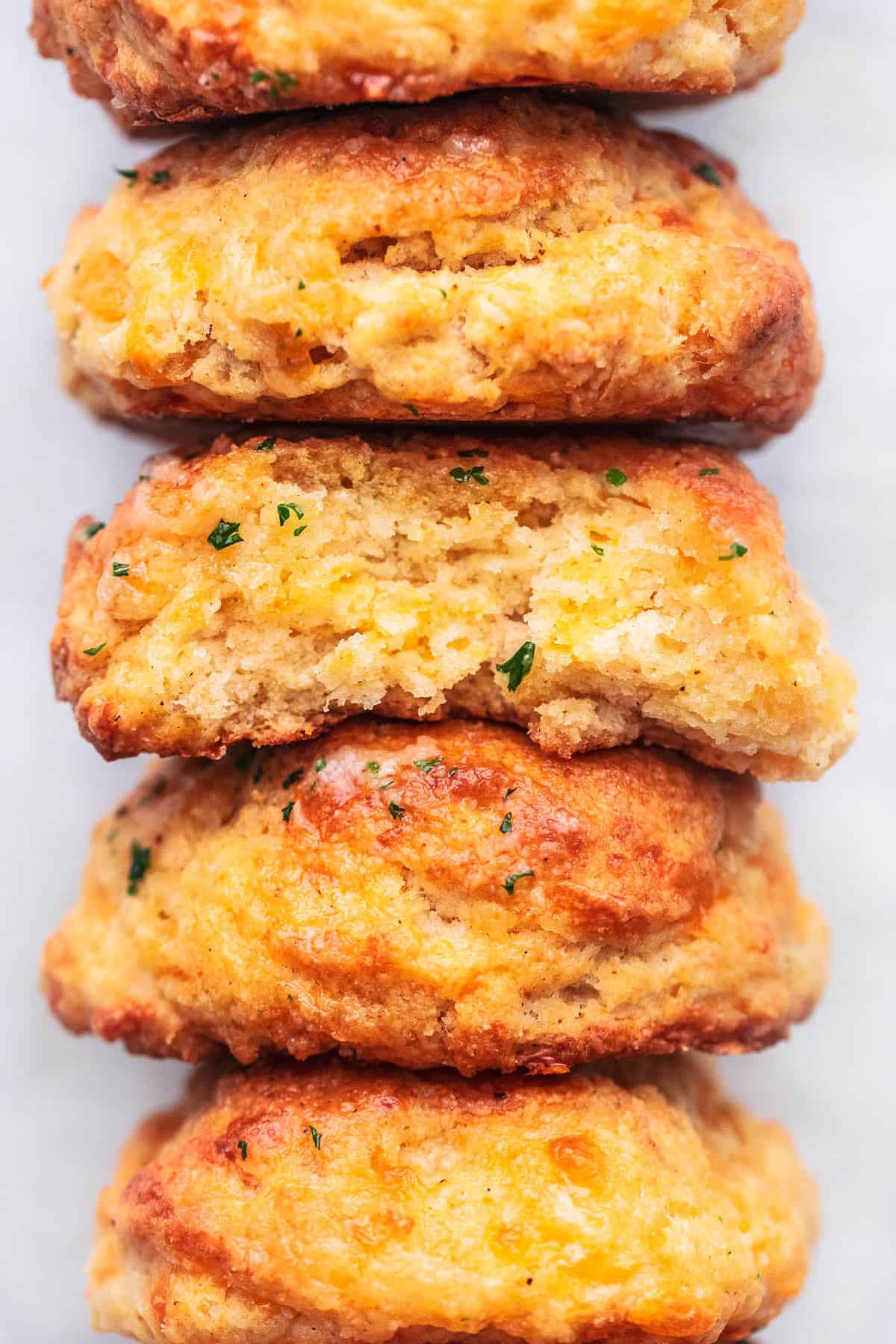 up close red lobster cheddar bay biscuits stacked on white surface